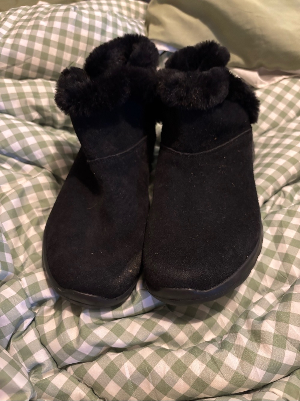 Skechers ankle boots featuring a plush faux-fur collar